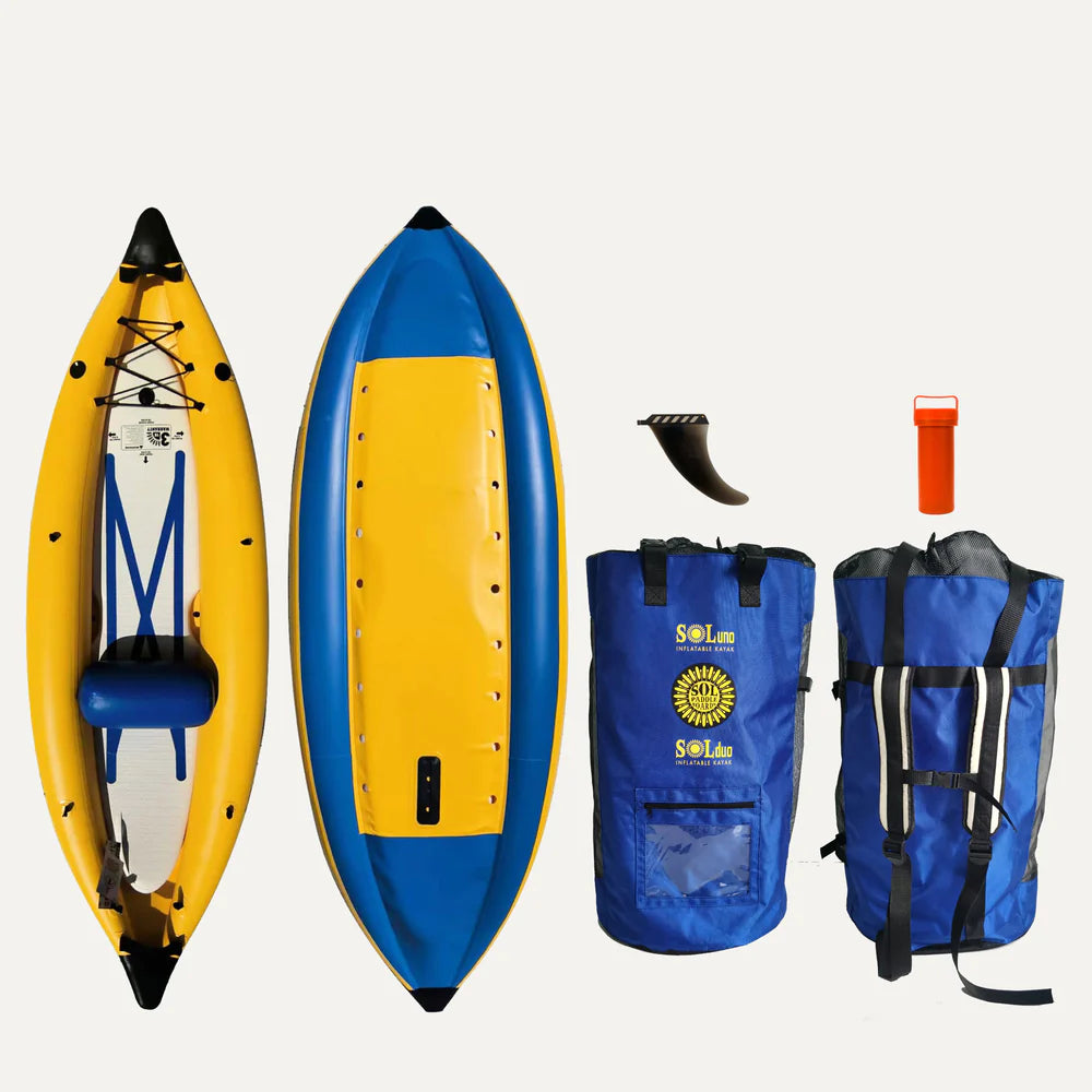 The GalaXy SOLuno Solo IK inflatable kayak set by SOL Paddle Boards features a vivid yellow and blue kayak made from reinforced material. It includes a carrying bag, detachable fin, red repair kit container, and oar holder, all stylishly arranged on a plain background.