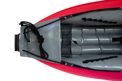 Top view of the interior of a Gumotex Baraka Inflatable Canoe, featuring gray seats, foot rests, black securing ropes and netting, and a self-bailing bottom designed for white water adventures.