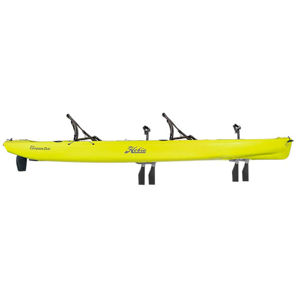 A yellow Hobie Mirage Compass Duo kayak on a white background.
