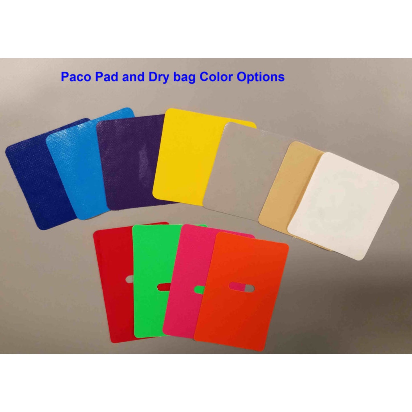 A variety of colored rectangular fabric and plastic samples are on display, featuring shades of blue, purple, yellow, gray, tan, white, red, green, and orange. Included is a waterproof PVC sample resembling the Pickup Paco Pad by Jacks Plastic Welding.