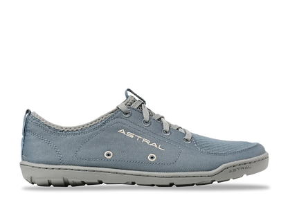 A gray casual sneaker, "Loyak - Women's" by Astral, features a rugged FlexGrip sole and fabric upper. Ideal for kayaking, it offers a low-top design for versatility and comfort.