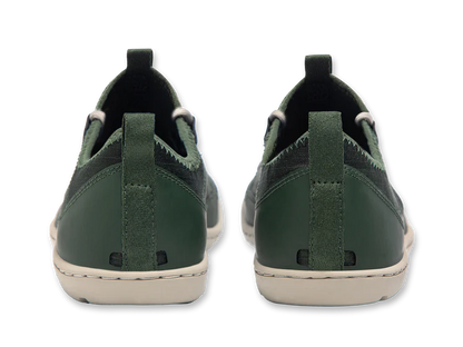 These Loyak AC men's casual shoes by Astral, seen from the back, are dark green with stitched details and durable white soles made of sticky G-Rubber outsoles for superior grip.
