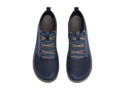 The Loyak AC by Astral is a pair of men's sneakers in navy blue with beige laces, featuring a textured ripstop mesh design and a sturdy sole equipped with sticky G-Rubber outsoles, shown from an overhead view.