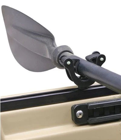A Cam-Lok Paddle Holder from Native Watercraft is attached to the side of a truck.