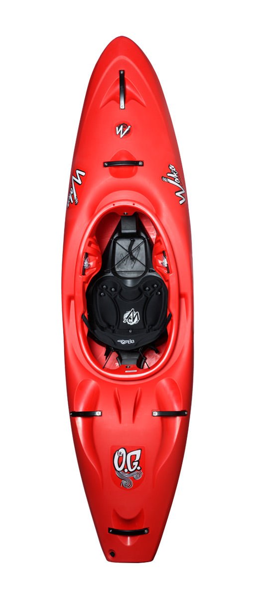 The agile red OG kayak by Waka Kayaks, viewed from above, showcases a black seat and footrests along with sleek black and white logos on its surface.