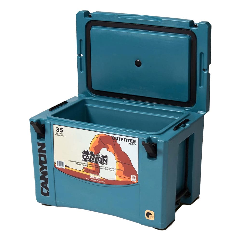 A Canyon Outfitter Series cooler with the lid open.