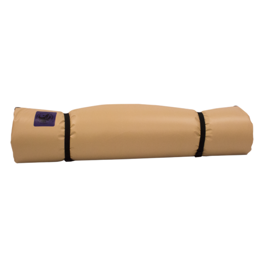 The Jacks Plastic Welding Pickup Paco Pad is a tan waterproof camping mattress, rolled up and secured with two black straps. A small purple label is on one end, shown against a plain white background.
