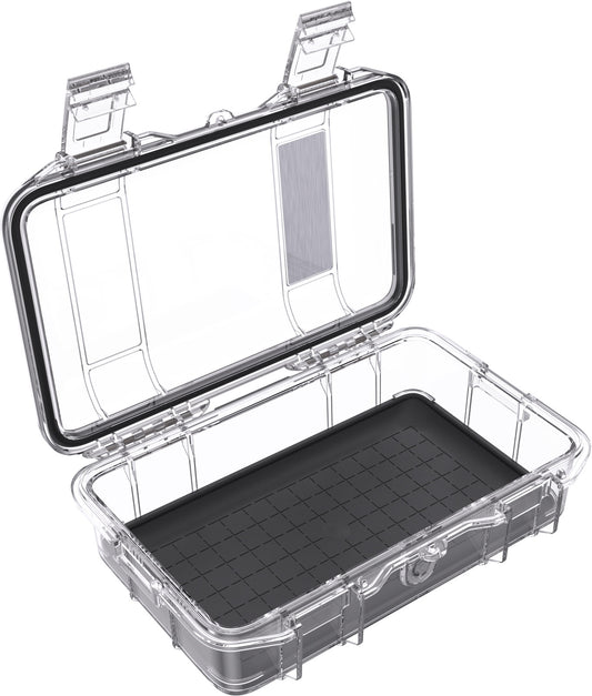 The Pelican M50 Dry Case is a transparent plastic storage case with an open hinged lid, black grid-patterned base, and two latches. This crushproof case provides durable protection for your valuables.