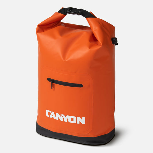 The Coulee Backpack Cooler by Canyon Coolers is an orange waterproof dry bag featuring a black roll-top opening, front zipper pocket, and "Canyon" logo in white letters, offering style and functionality for your adventures.