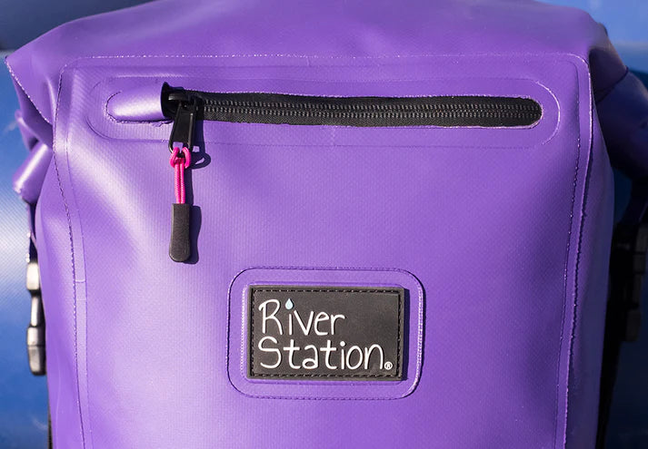 Purple Dry Thwart Bag - V2 with a zippered pocket and a "River Station Gear" logo patch.