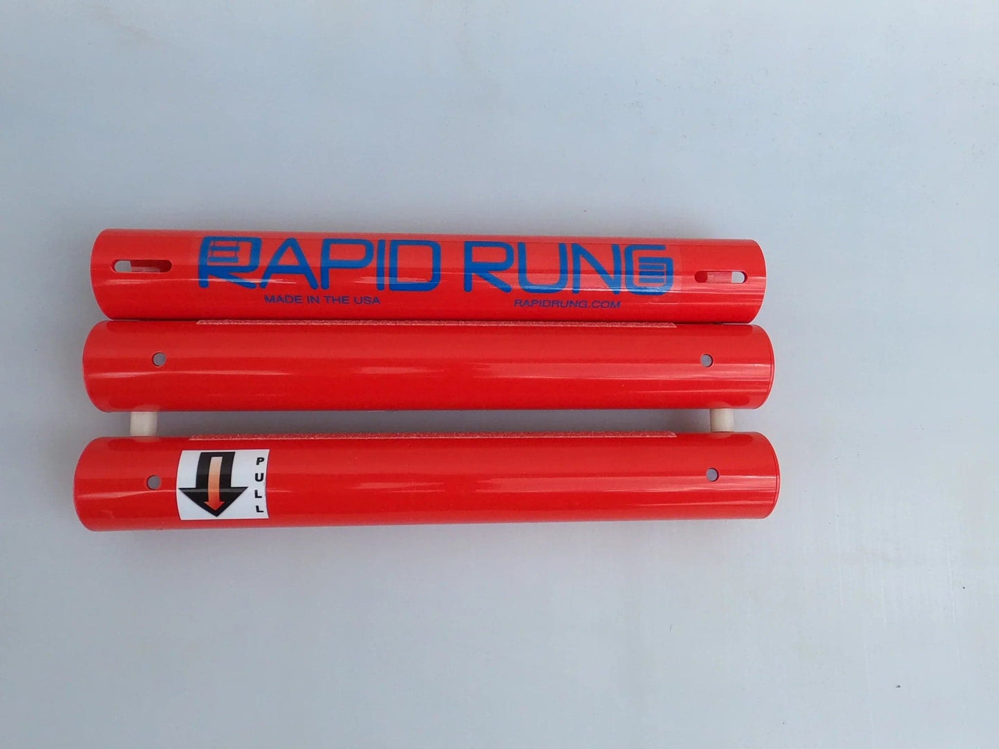Two red tubes with the word Rapid Rung on them.