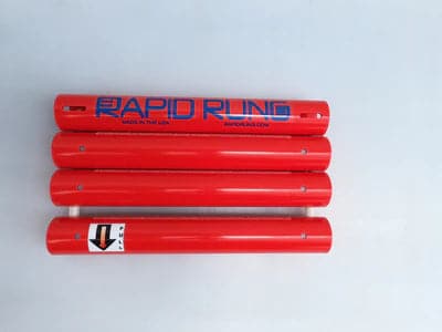 A set of four red Raft Ladder batteries with the word Rapid Rung on them.