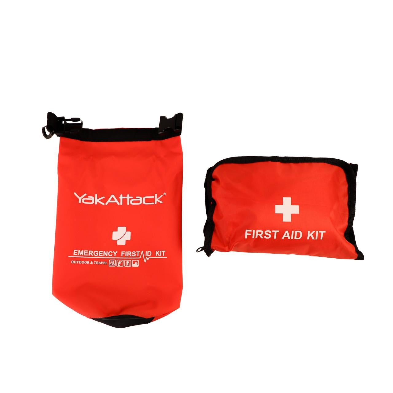 Two red waterproof YakAttack Reel Essentials First Aid Kit bags, ideal for outdoor adventures—one stands upright with the kit name, the other lies flat labeled "First Aid Kit," both displaying a white cross symbol.