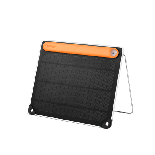 The BioLite SolarPanel 5+ features a black surface, orange top edge, and built-in stand—perfect as a solar phone charger—shown on a plain white background.