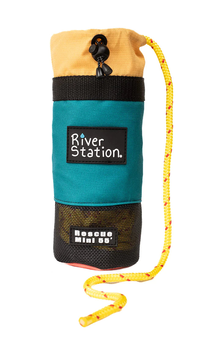 Throw bag for water rescue labeled "River Station Gear", designed for kayak rescues with a quick-drying rope partially unraveled.