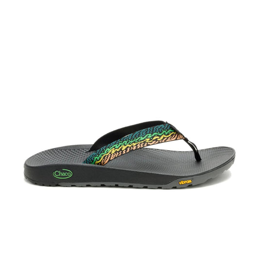The Chaco Rapid Pro Flip Flop for men features a black, textured sole with a Vibram outsole and green, yellow, and black patterned straps—delivering ultimate water performance with bold Chaco and Vibram logos.