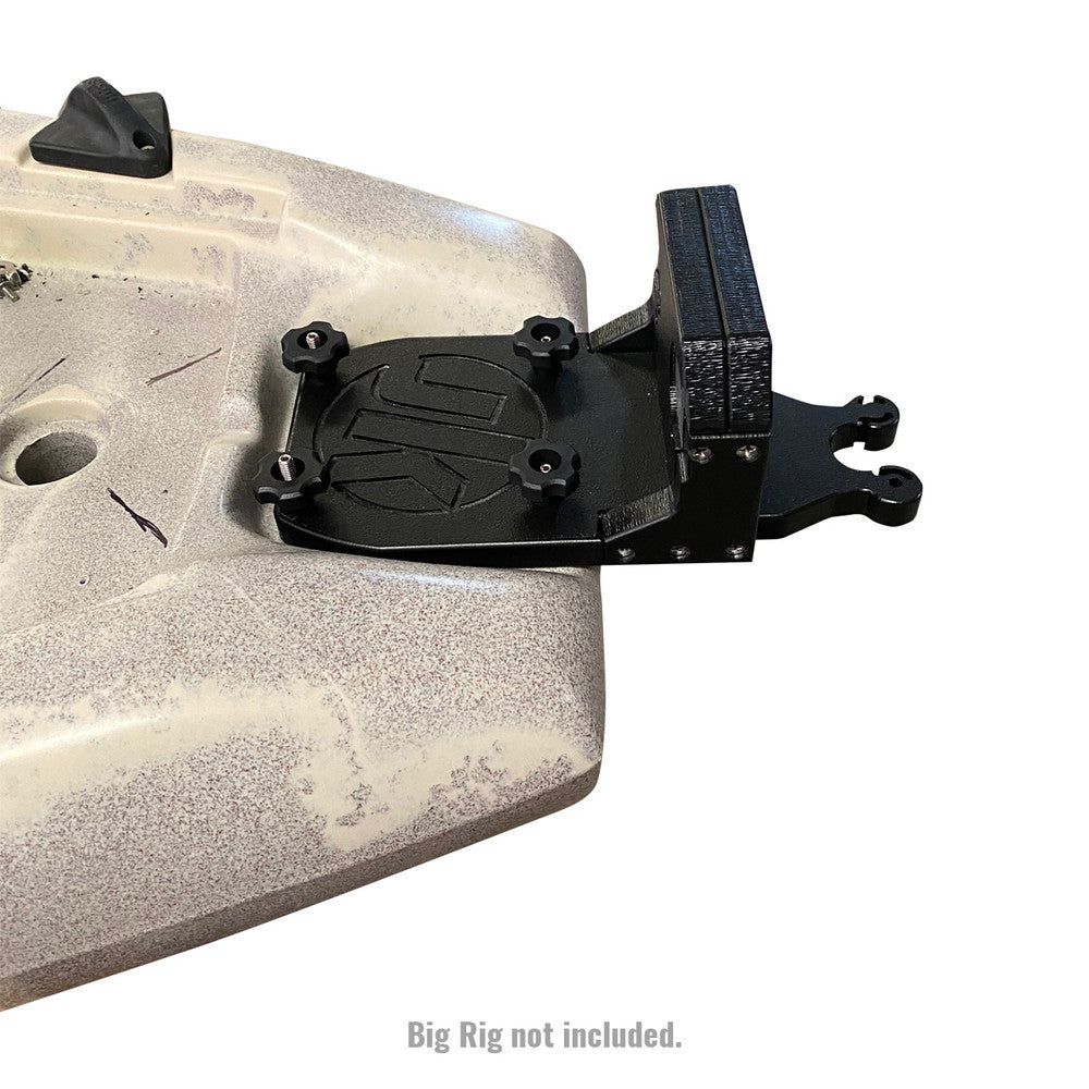 A close-up of a black mounting bracket, specifically the Jackson Kayak YakGadget Transom Motor Mount XD, installed on a beige surface with text below stating, "Big Rig not included.