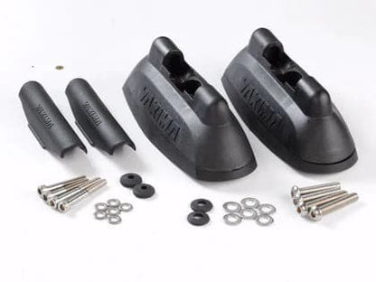 a pair of Yakima Landing Pads with screws and bolts.