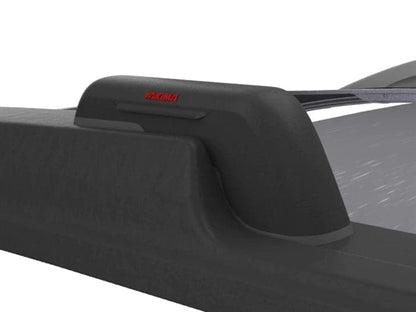 a black car with a Yakima Landing Pads roof rack.