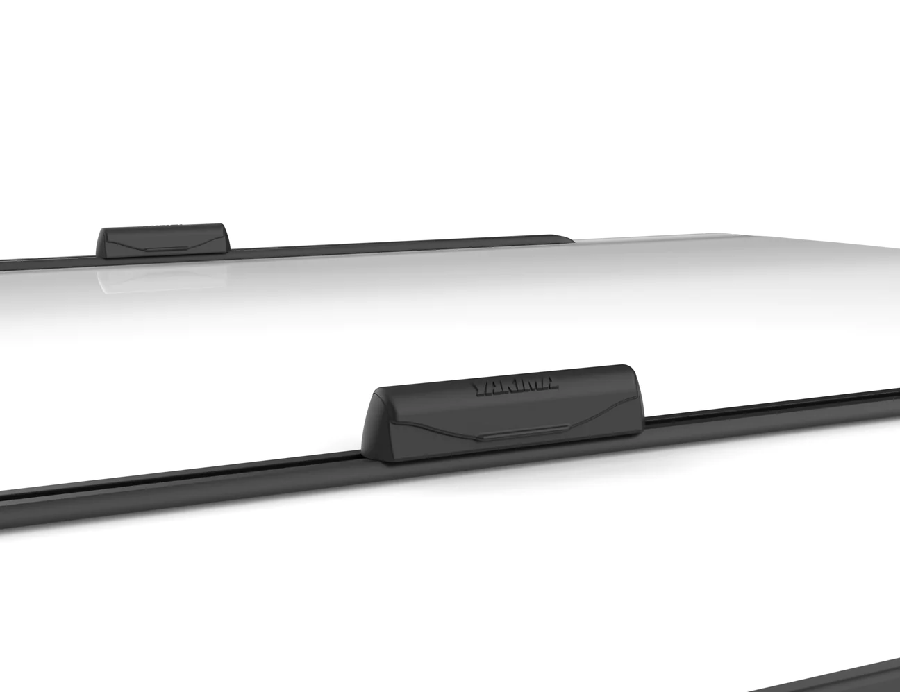 a black and white picture of a Yakima Landing Pads car roof rack.