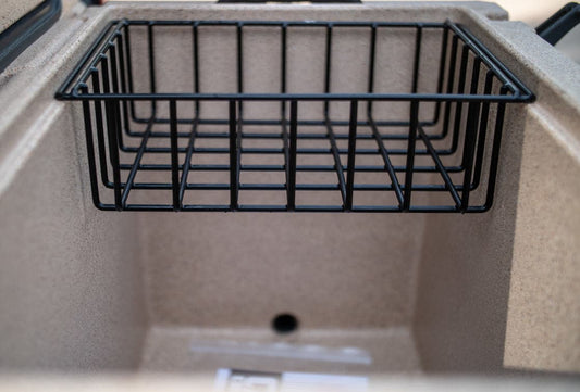 The beige interior includes a removable black metal Cooler Basket by Canyon Coolers, made from heavy gauge wire with a small drain hole, ensuring organization, durability, and easy cleaning.