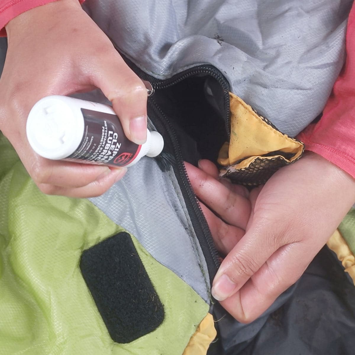 Featuring the Zipper Cleaner & Lubricant adhesive, glue, kayak care, kayak repair manufactured by NRS shown here from a third angle.