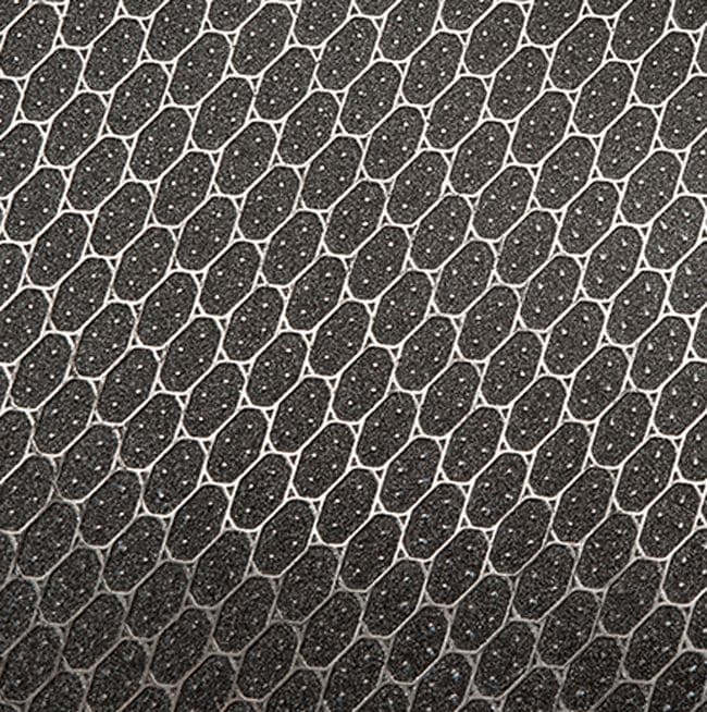 Interconnected hexagonal shapes with a dotted texture, reminiscent of the GSI Outdoors Gourmet Griddle, all in sleek black and white.