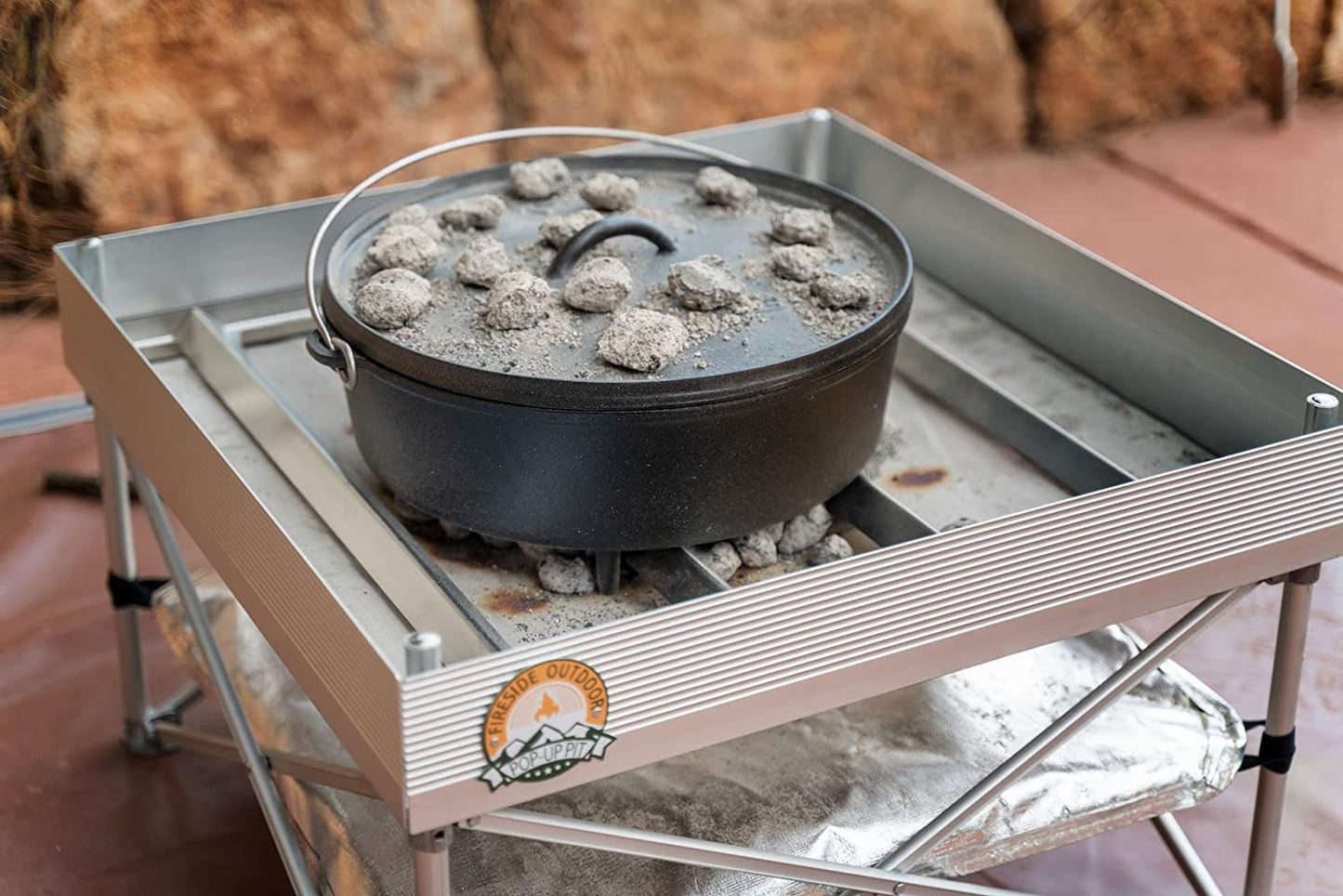 Featuring the Pop-Up Fire Pit Frontier Grate dutch oven, fire pan accessory manufactured by Fireside shown here from a fourth angle.