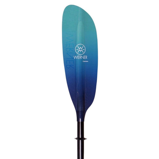 The Werner Paddles Camano fiberglass touring kayak paddle features a low-angle blade design with a gradient finish and the iconic Werner logo, complete with a wave symbol.