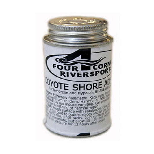 The Shore Adhesive for Hypalon by Coyote River Gear, available at Four Corners Riversports, is perfect for repairing Hypalon and neoprene. It comes in a small canister with a metal screw cap and includes clear warning and usage instructions on the label.