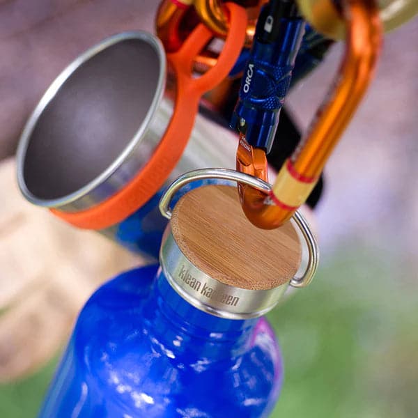 Featuring the Bamboo Cap camp, dishes, gifts under $25, hydration, replacement lid, sustainable manufactured by Klean Kanteen shown here from a second angle.