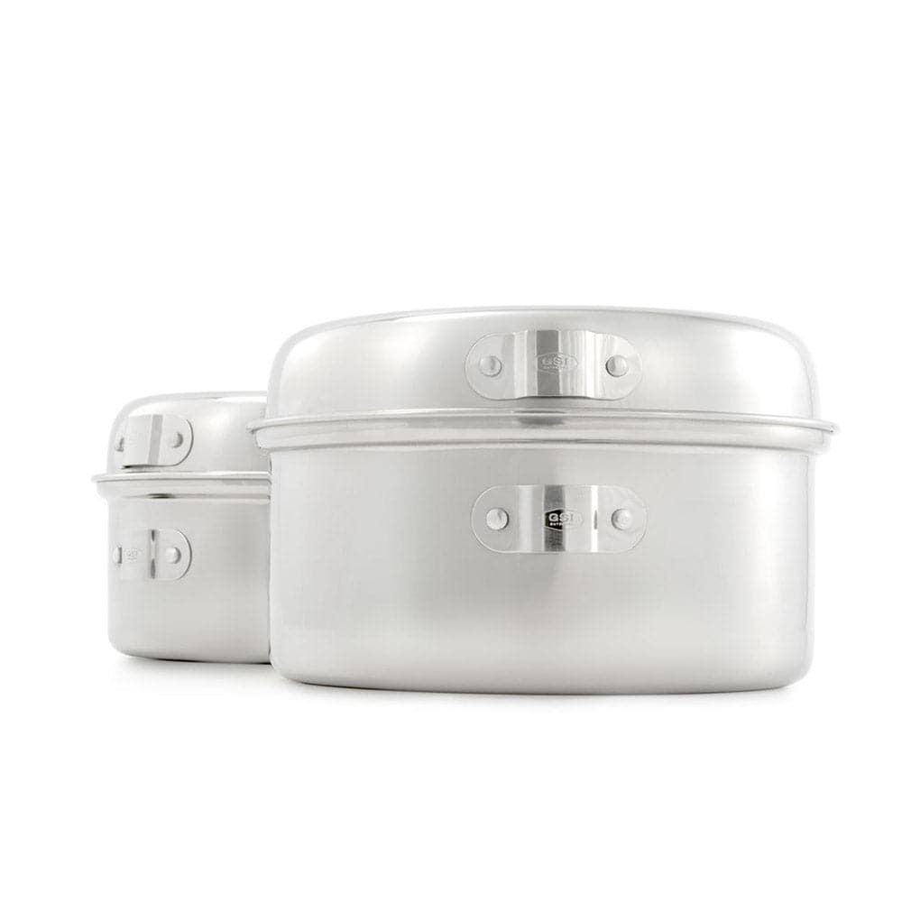 A pair of sleek, silver aluminum stackable cooking pots with latches is set against a white background, highlighting their compact design. Similar to GSI Outdoors' Glacier Stainless Cookset, they ensure durability and elegance for today's modern kitchen.
