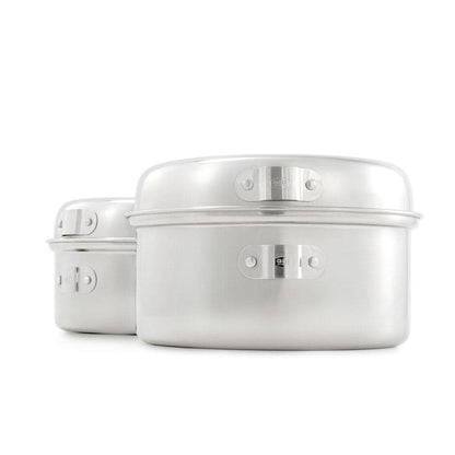 A pair of sleek, silver aluminum stackable cooking pots with latches is set against a white background, highlighting their compact design. Similar to GSI Outdoors' Glacier Stainless Cookset, they ensure durability and elegance for today's modern kitchen.