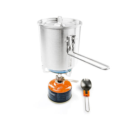 The Glacier Explorer Set by GSI Outdoors is a lightweight backcountry stove with an aluminum pot, fueled by an orange gas canister. This camp set also includes a collapsible spork, ideal for any adventure.