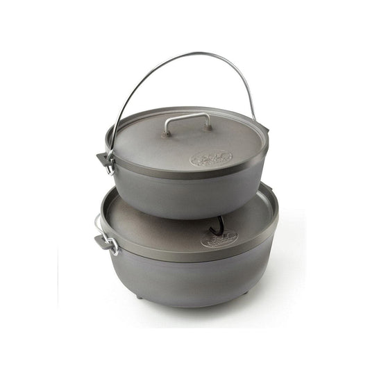 Two stacked gray cast iron Dutch ovens with lids and metal handles, designed by GSI Outdoors, feature a lightweight design similar to the 12-inch Dutch Oven.