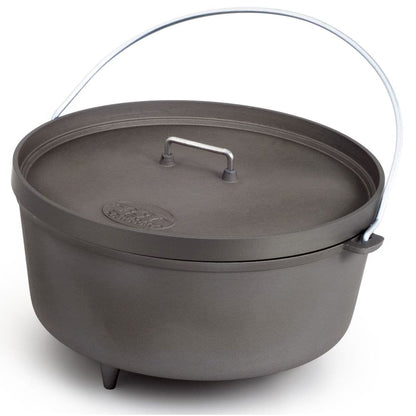 The GSI Outdoors Dutch Oven - 12in is a black, lightweight cookware piece featuring a metal handle and three legs for versatile cooking.