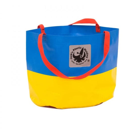 A round tote bag made from durable PVC rafting material features blue and yellow panels, red handles, and a logo on the front. Product Name: Collapsible Water Bucket - 2 Handle by Jacks Plastic Welding.