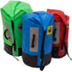 Explore Jacks Plastic Welding's Outfitter Dry Bag, crafted with welded 18oz PVC. These waterproof bags, in green, blue, and red, have roll-top closures and durable black bases. Perfectly built for adventure with a polyethylene stiffener for enhanced performance and reliability.