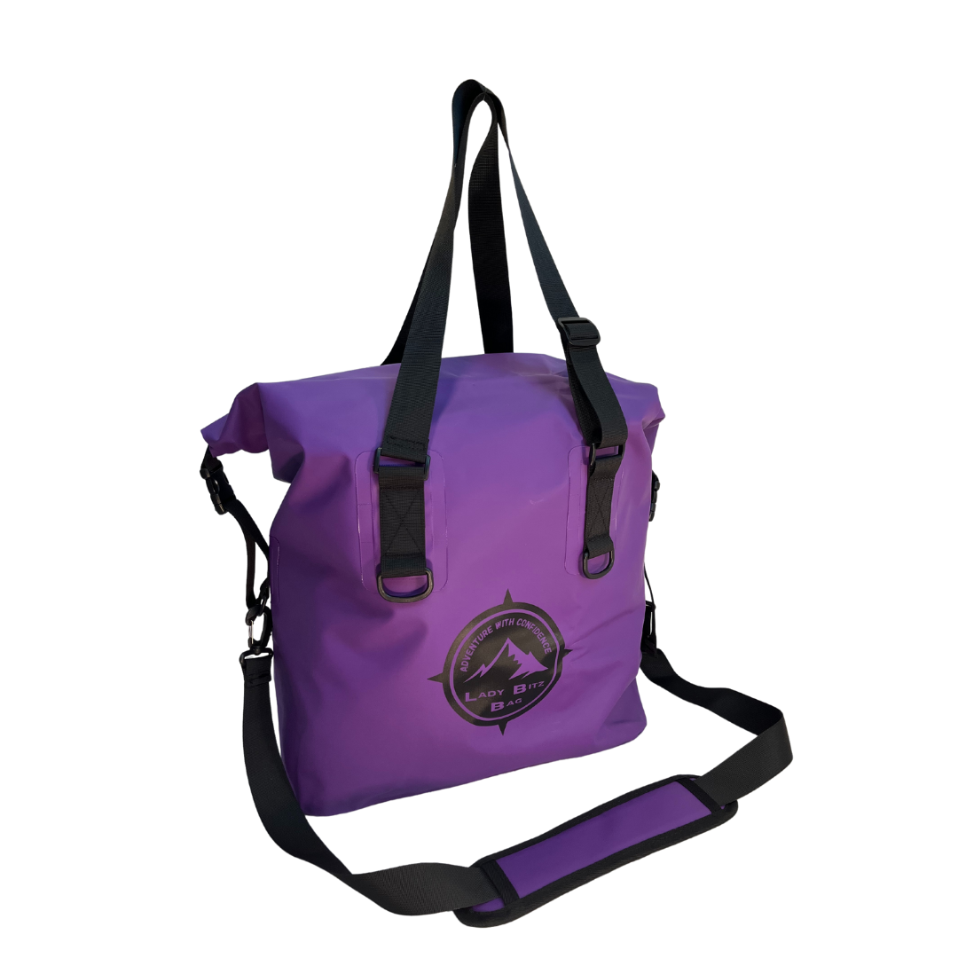 a purple bag with a black strap.