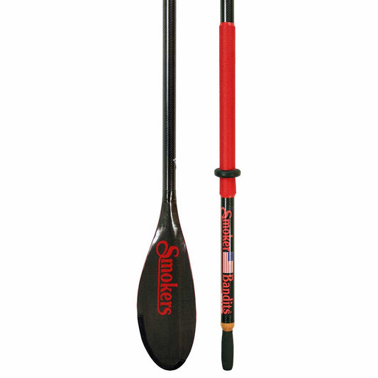 Close-up of a Sawyer Smoker Bandit Oar showcasing a sleek carbon fiber blade with "Smokers" in red text, complemented by a red handle featuring the word "Bandits" alongside an American flag design.