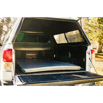 Featuring the Truckbed Landing Pad sleep pad manufactured by AIRE shown here from a fourth angle.