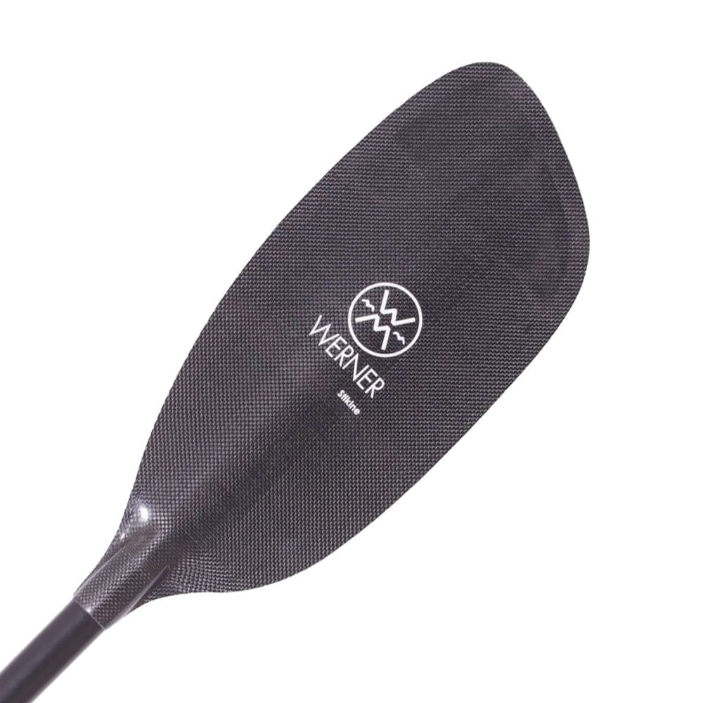Close-up of a Werner Paddles' Stikine kayak paddle with a dark carbon fiber blade, perfect for whitewater adventures, featuring the iconic Werner logo in white.