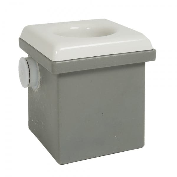 The square gray and white box, featuring a round attachment on the side, reflects the functionality of Coyote River Gear's Portable Camp Toilet System II.