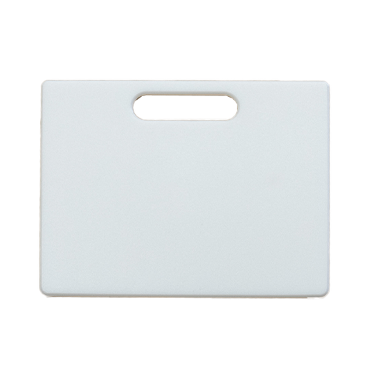 The Prospector 103 Divider by Canyon Coolers, a rectangular white cutting board with a top-center handle slot, is BPA-free, dishwasher safe, and NSF food safe, ensuring convenience and safety in your kitchen.