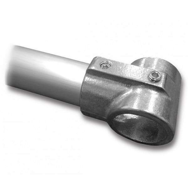 Close-up of a metal pipe joint connector with two screws, joining a cylindrical pipe to a sturdy clamp, similar to Down River Equipment's Speedrail #5E Tee Fittings used in raft frames.