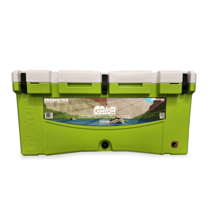 Canyon Coolers' Prospector 103 Raft Cooler, featuring a white lid, handles, "Prospector" branding, and a landscape illustration on the front. This bear-resistant cooler combines durability and style for outdoor adventures.