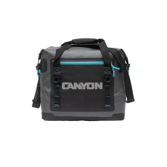 Gray and black duffel bag branded "Canyon," from the Canyon Coolers Nomad Series Soft Cooler, includes a front waterproof zipper pocket, top handles, and an adjustable shoulder strap.